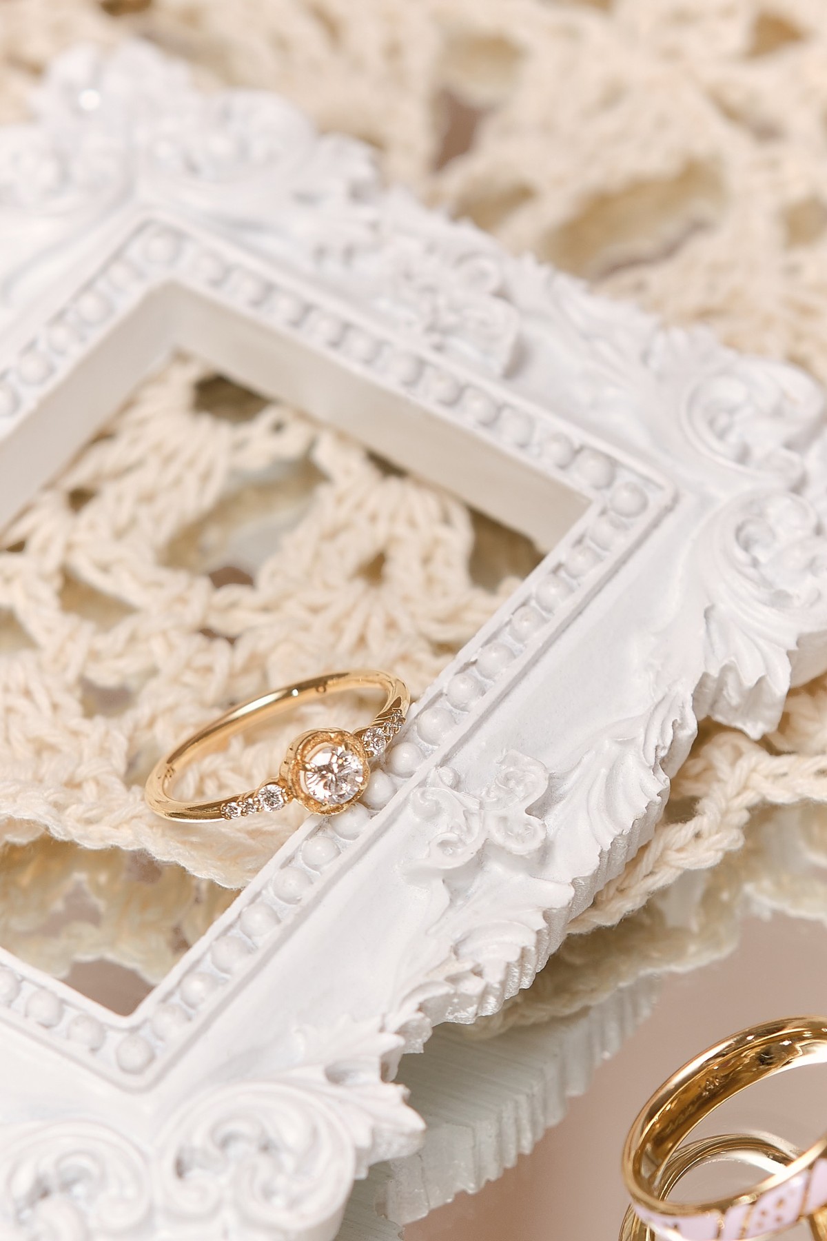 Jewelry styled with lace and a decorative frame