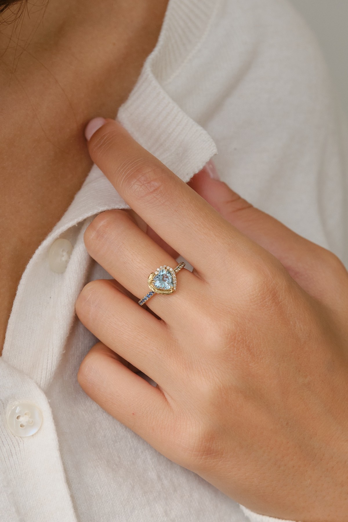 Ring worn against a white shirt
