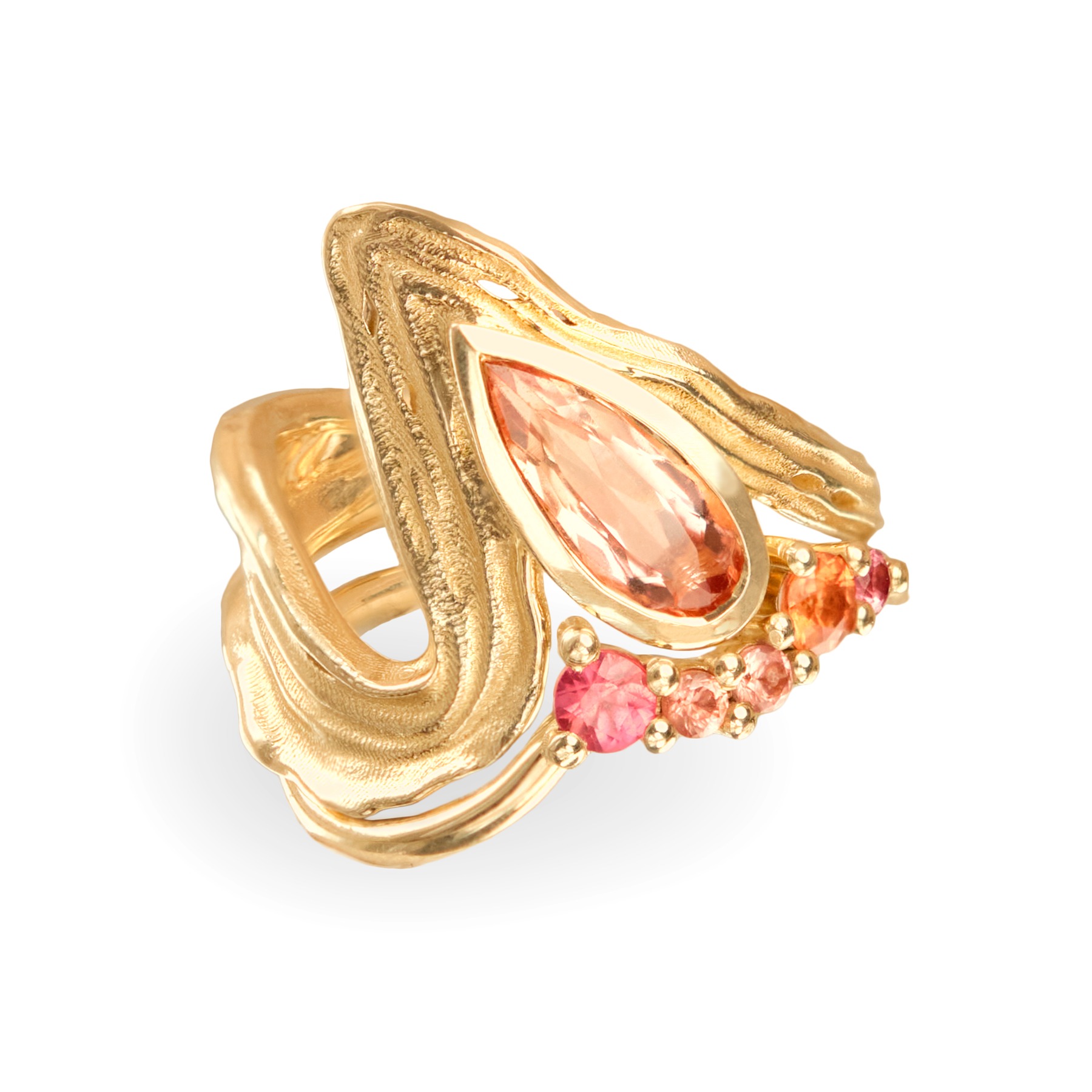 Sculptural gold ring with peach and pink stones on white